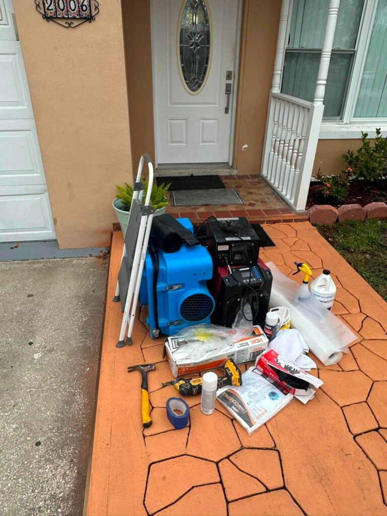 Water damage restoration equipment staged outside a Bellingham, WA home during setup