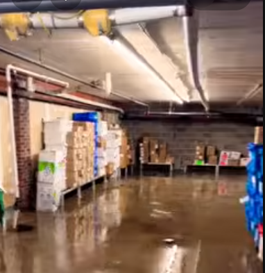 Basement with exposed pipes and ductwork during fire and water damage restoration