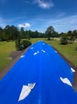 Blue tarp covering a storm-damaged roof to prevent further leaks in a Bellingham, Washington home.